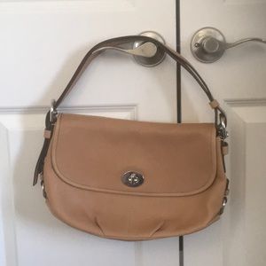 Coach tan leather bag with silver hardware.